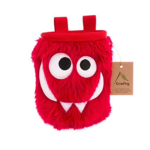 DAs Bild zeigt ein rotes Foodie Chalk Bag Monster mit verdrehten Augen, einem Grinsen und zwei Zähnen.